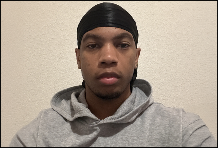 Young man in a gray sweatshirt.