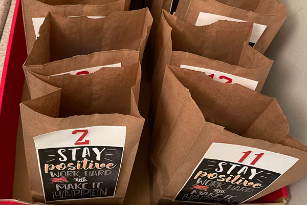 Photo of brown paper bags with positive words.